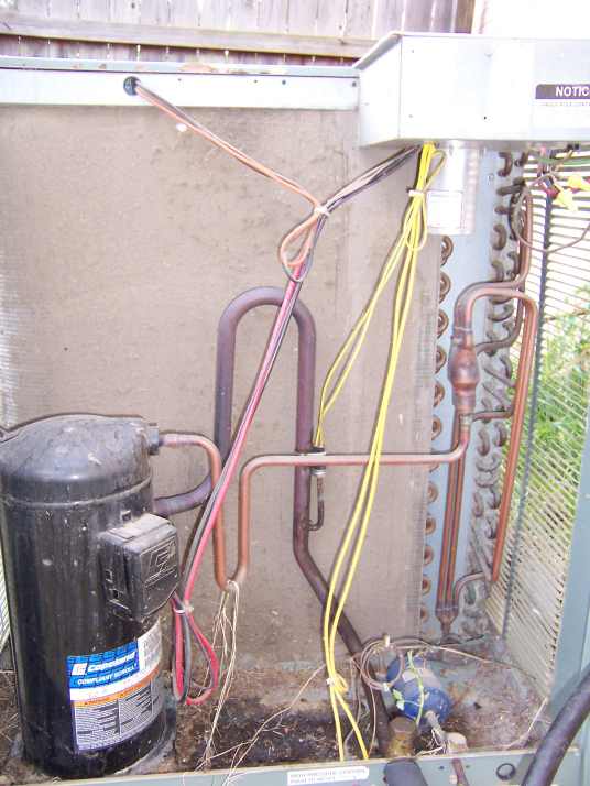 Photo of dirty condensor completely clogged with fine dirt.