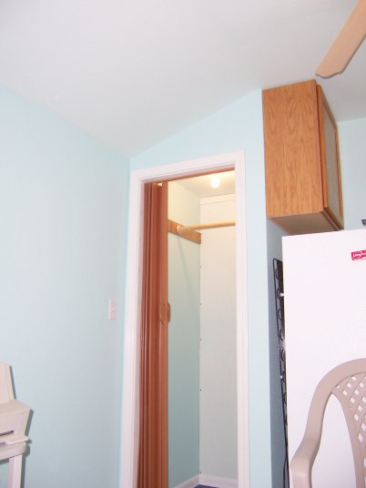 The closet is extra deep to leave room for a tankless water heater and still have plenty of room for clothes.