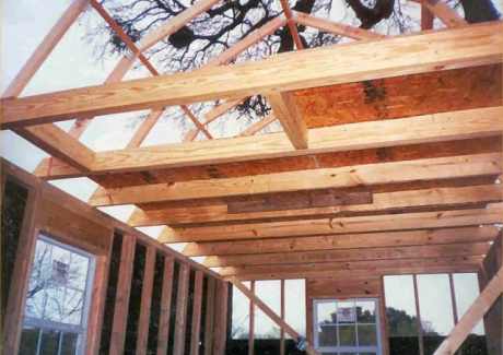 Opening in ceiling to left is for disappearing stairs. Roof is already installed above.